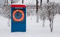 Combination of summer lifesaving equipment and winter snow background.