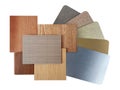 combination of various texture and colors of wooden veneer and stainless metallic samples isolated on background.