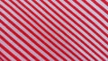 a combination of white and red that forms a line in the texture of a cloth