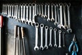 Combination wrenches set in auto repair shop. Mechanics repairing, maintaining car in garage. Royalty Free Stock Photo