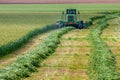 Combine on agricultural field during crop harvesting.