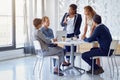 They combine business and success. a team of businesspeople working on a laptop together at a table in the office. Royalty Free Stock Photo