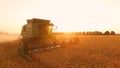 Combine, field and sunrise. Royalty Free Stock Photo