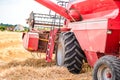 combine harvester in action in grain fields Royalty Free Stock Photo