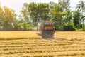 Combine harvester in action on rice field. Harvesting is the process of gathering a ripe crop from the fields Royalty Free Stock Photo