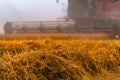 Combine harvester in action on wheat field. Wheat Harvesting. Royalty Free Stock Photo