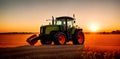 A combine harvester or agricultural tractor is processing or harvesting wheat in a field in the afternoon at sunset