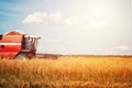 Combine harvester agriculture machine harvesting golden ripe wheat Royalty Free Stock Photo