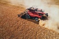 Combine harvester agriculture machine harvesting golden ripe wheat field