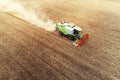 Combine harvester agriculture machine harvesting golden ripe wheat field Royalty Free Stock Photo