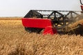 Combine harvester close up. Combine harvester harvesting wheat. Grain harvesting combine. Combine harvesting wheat. Wheat field bl Royalty Free Stock Photo