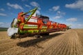 Combine harvester close up in wheat field, harvesting. focus on the reaper Royalty Free Stock Photo
