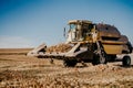 Farmer using combine harvester and collecting corn.Combine working in agricultural fields.