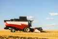 Combine harvester with cutter platform at work Royalty Free Stock Photo