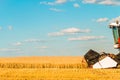 Combine harvester with cutter platform at work Royalty Free Stock Photo