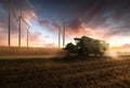 Combine harvester in evening action Royalty Free Stock Photo