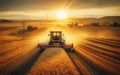 Combine harvester harvesting ripe wheat on big wheat field and tractor Royalty Free Stock Photo