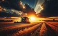 Combine harvester harvesting ripe wheat on big wheat field and tractor Royalty Free Stock Photo