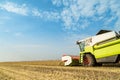 Combine harvester harvesting soybean at field. Royalty Free Stock Photo