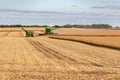 A combine harvester harvesting a soybean field Royalty Free Stock Photo