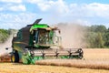 Combine harvester harvesting wheat field, harvesting is the process of gathering a ripe crop Royalty Free Stock Photo