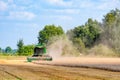 Combine harvester harvesting wheat field, harvesting is the process of gathering a ripe crop Royalty Free Stock Photo