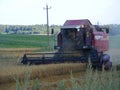 Combine harvester on a oast field. Machine, heavy.