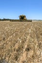 A combine harvester reaping a wheat crop in Australia.