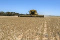 A combine harvester reaping a wheat crop in Australia.