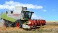 Combine harvester reaping the wheat fields