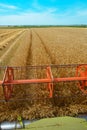 Combine harvester revolving reel harvesting wheat crops