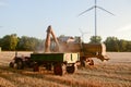 Combine harvester unloads wheat grain Royalty Free Stock Photo