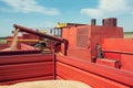 Combine harvester unloads wheat grain into the tractor trailer. Royalty Free Stock Photo