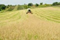 Combine harvester in wheat field during harvesting Royalty Free Stock Photo