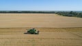 Combine harvester on wheat field