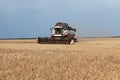 Combine harvester in a wheat or rye field, strada, harvesting. Gathering crop by agricultural machinery on field on summer season