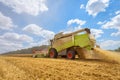 A combine harvester at work on a field. Royalty Free Stock Photo