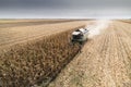 Combine harvester working in a corn field