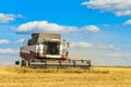 Combine harvester is working in the field for harvesting