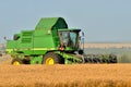 Combine harvester working the field Royalty Free Stock Photo