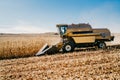 Combine harvester working in the fields. Agriculture Farmer working with machinery