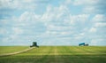 Combine harvester working on a wheat crop, panorama