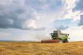 Combine harvester working on a wheat field. Harvesting wheat Royalty Free Stock Photo