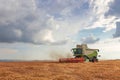 Combine harvester working on a wheat field. Harvesting wheat Royalty Free Stock Photo