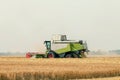 Combine harvester working on a wheat field. Harvesting wheat Royalty Free Stock Photo