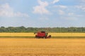 Combine harvester working on wheat field. Harvesting the wheat. Agriculture concept Royalty Free Stock Photo