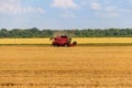 Combine harvester working on wheat field. Harvesting the wheat. Agriculture concept Royalty Free Stock Photo