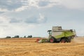 Combine harvester working on a wheat field. Harvesting wheat. Royalty Free Stock Photo