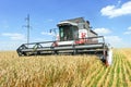 Combine harvester working on a wheat field