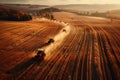 Combine harvesters working on an autumn field Royalty Free Stock Photo